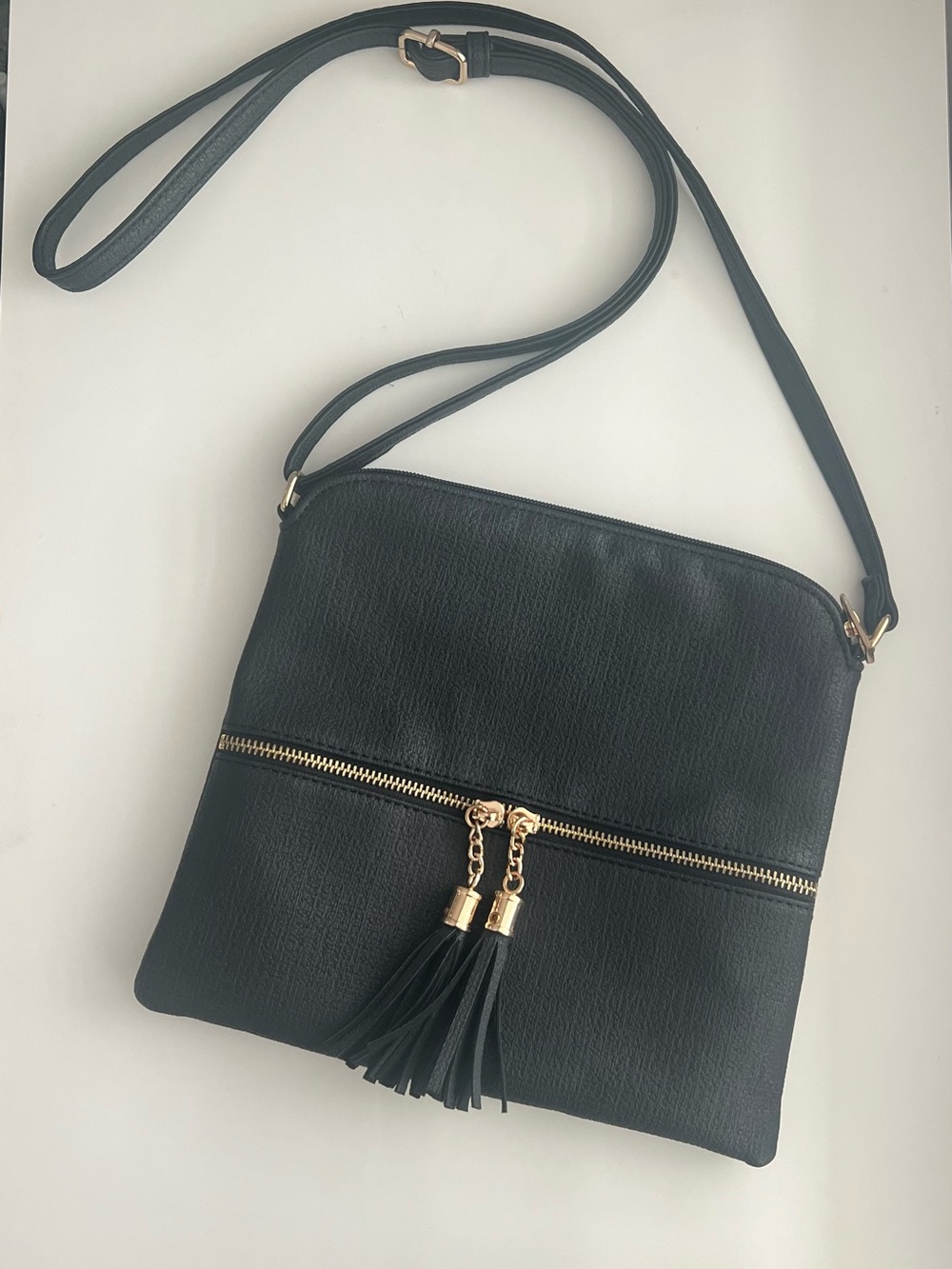 Black Crossbody Bag with Gold Tassel Zip Detail